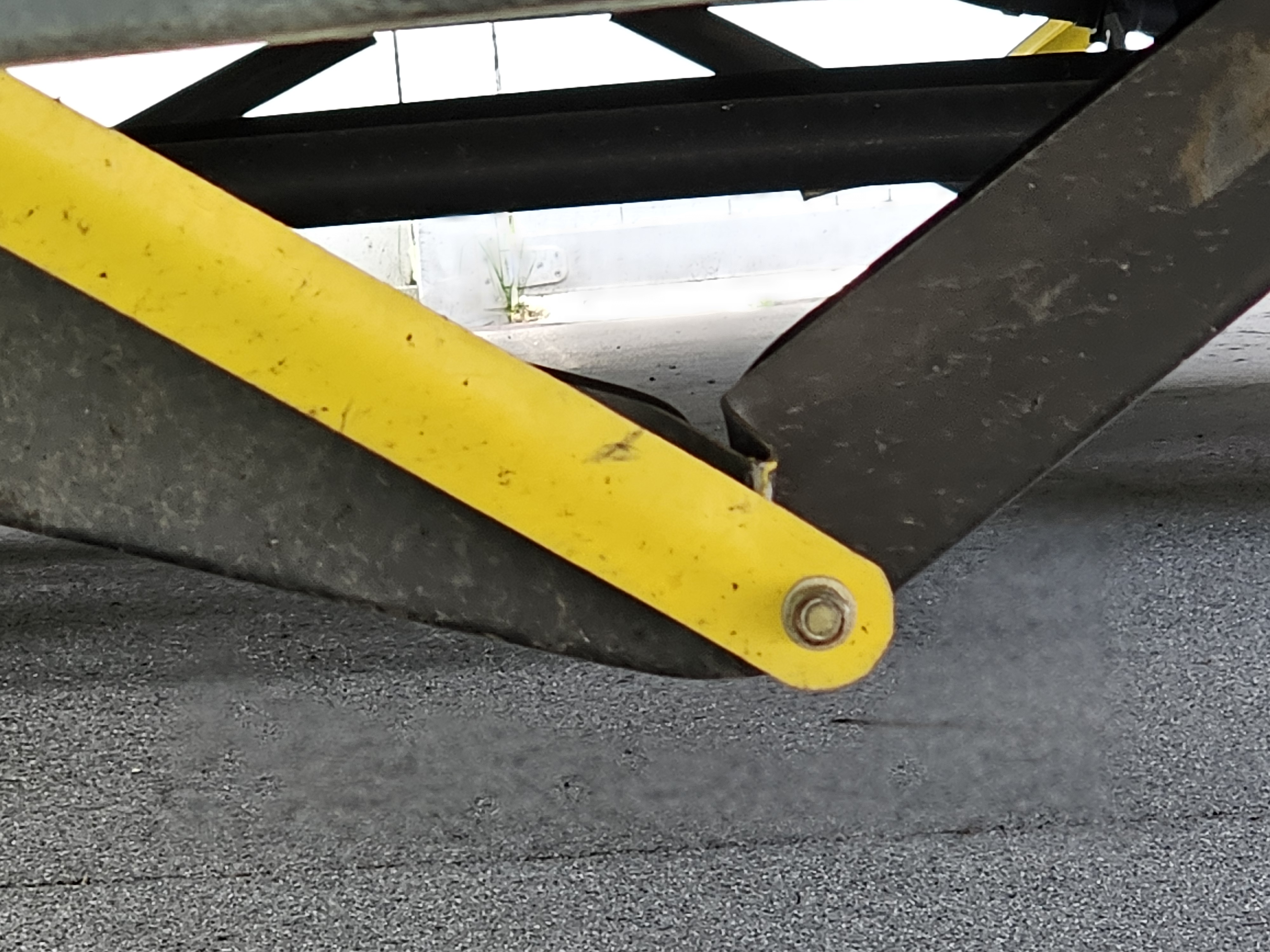 close up of bent camper stabilizer jack